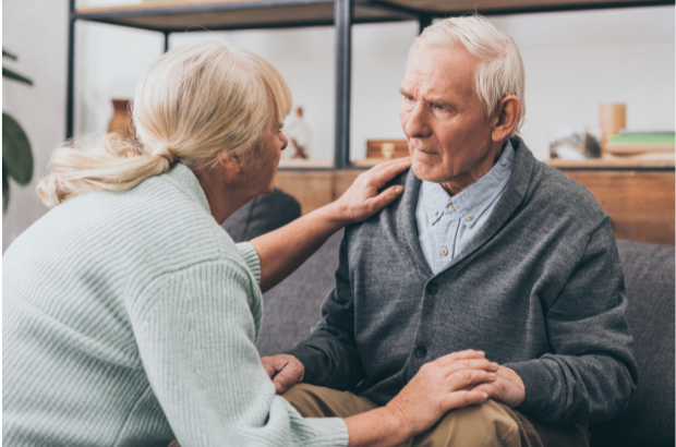 elderly man sitting with a confused look due to dementia