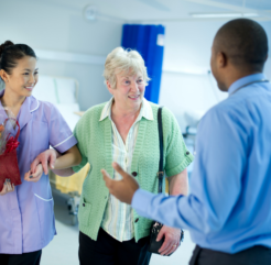 Caregiver accompanying senior after hospital visit