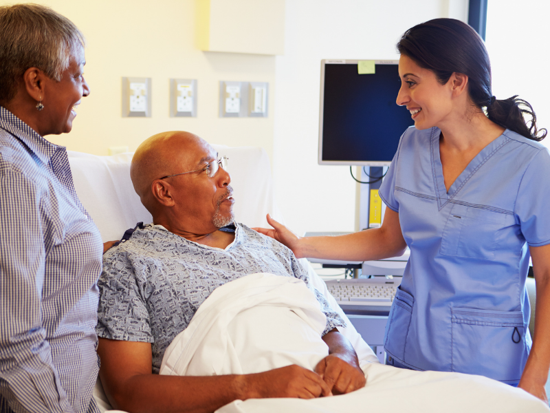 Caregiver Visiting Senior at The Hospital