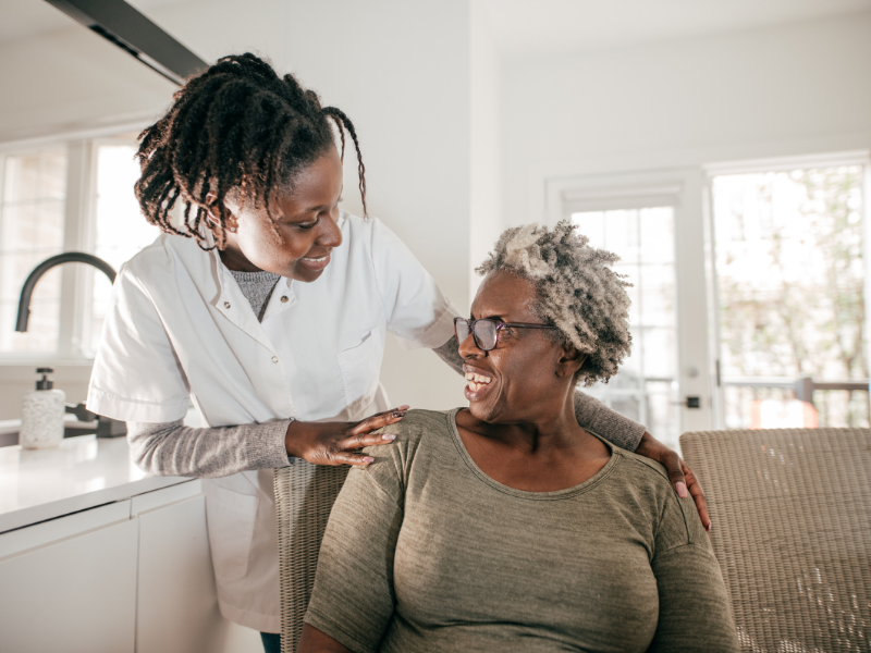 Caregiver Comforting Senior Patient