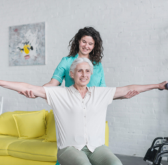 Caregiver Helping Senior with Simple Exercise at Home