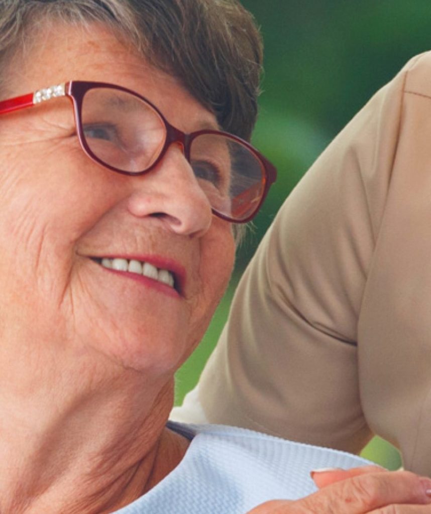 old lady with glasses smiling