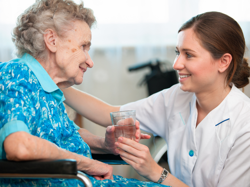 old lady smiling with nurse